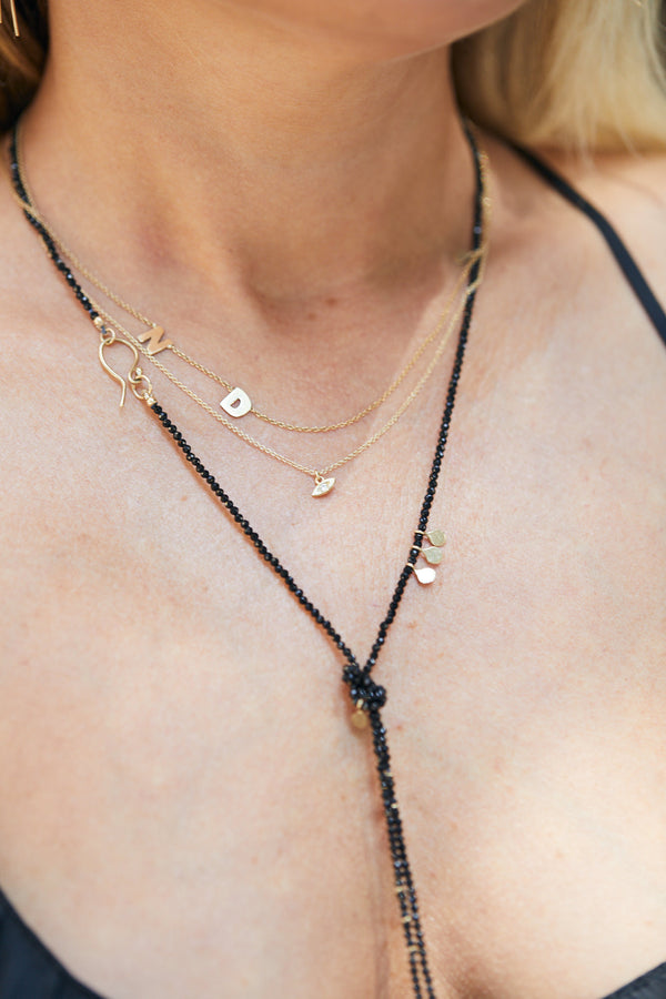 14k eye necklace with white diamond