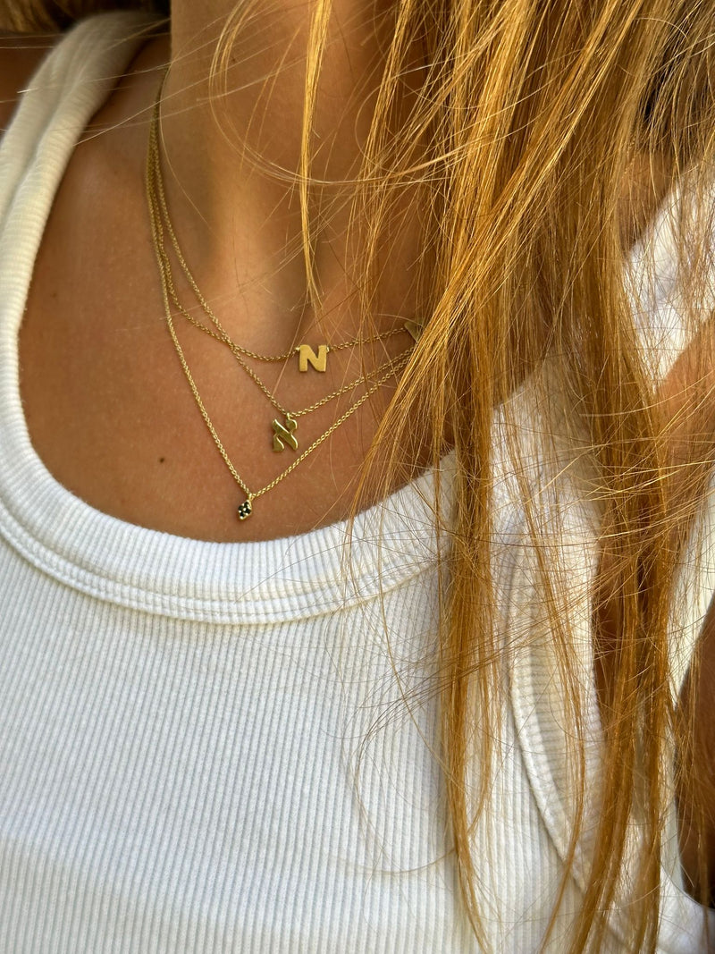 14K gold necklace with a letter