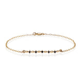 14K gold segments bracelet with black diamonds